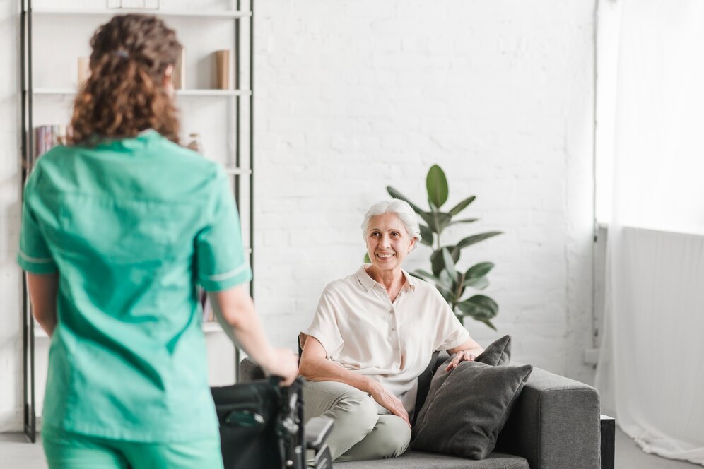 nurse-with-wheelchair-standing-ion-front-happy-female-patient_23-2147861470 nurse-with-wheelchair-standing-ion-front-happy-female-patient_23-2147861470