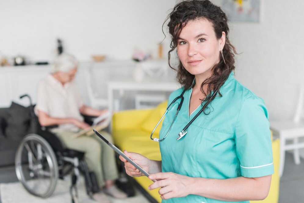 portrait-female-nurse-holding-digital-tablet-standing-front-senior-patient-wheelchair_23-2147861540 portrait-female-nurse-holding-digital-tablet-standing-front-senior-patient-wheelchair_23-2147861540